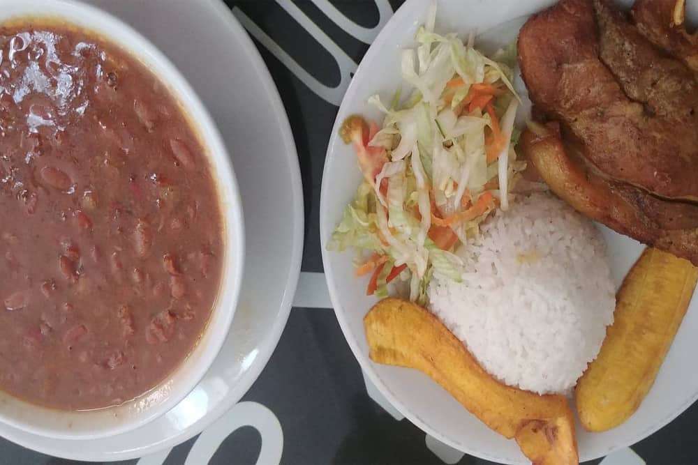 White Rice and stew, salad, plantain, and Chicken